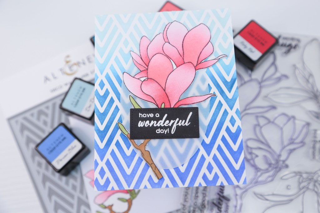 A beautiful pink flower card adorned with blue geometric background. Perfect for any occasion! Altenew products.