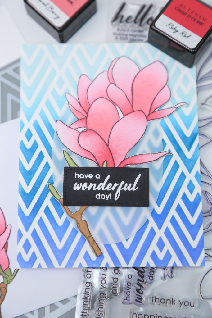 A beautiful pink flower card adorned with blue geometric background. Perfect for any occasion! Altenew products.