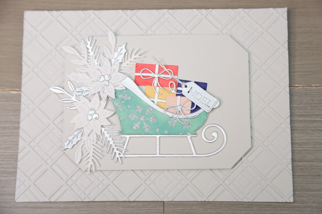 Spellbinders Delivering Joy sleigh die set used for an elegant card