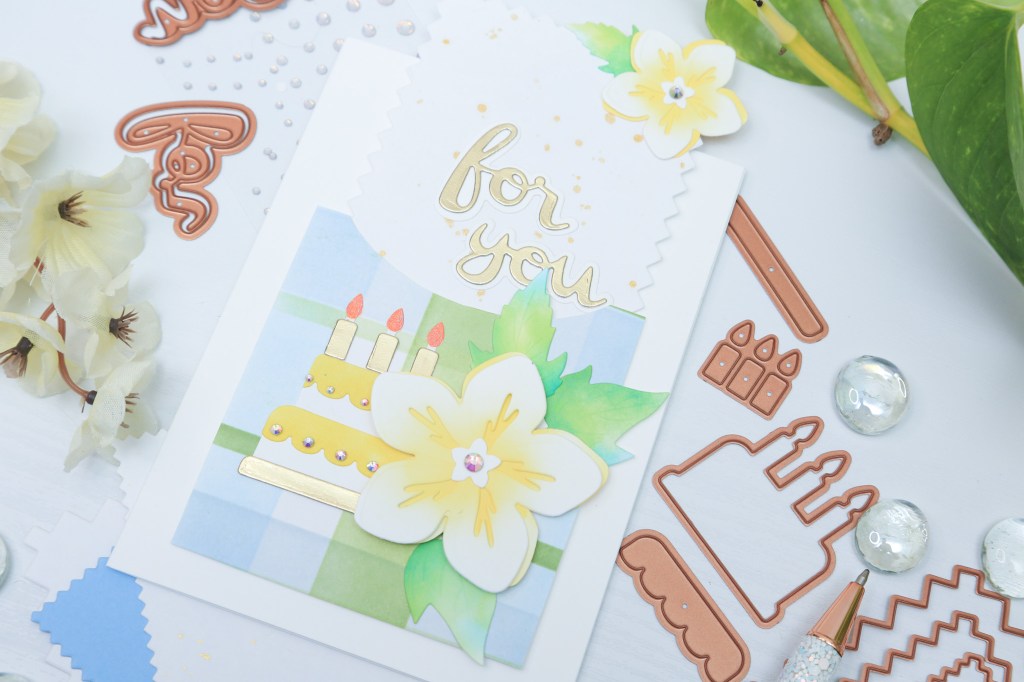 Spellbinders pinking edges dies used to create a greeting card with florals from essential envelope dies by Spellbinders, and Spellbinders' build a plaid stencil set