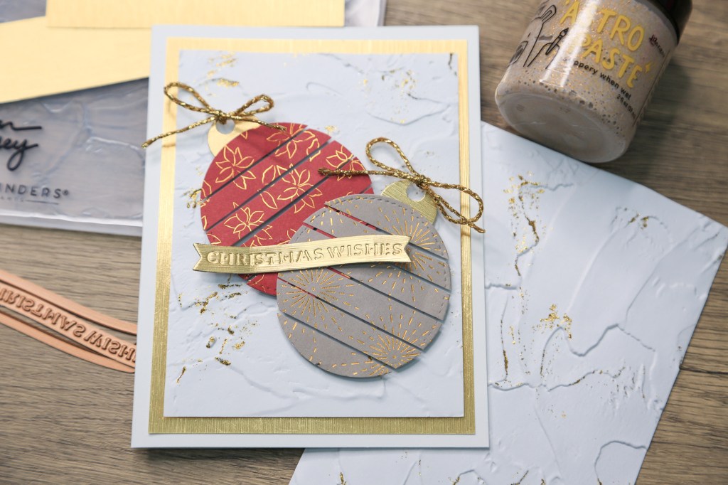Cute DIY Christmas card decorated with Christmas Ornaments made using pattern paper.