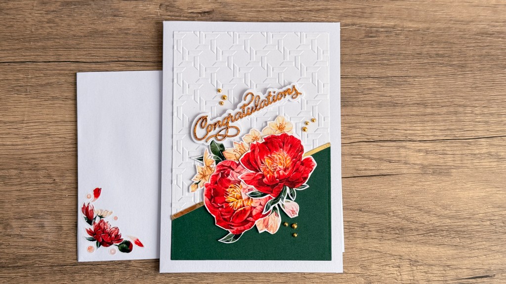 Peony die cuts with washi tape on embossed background.