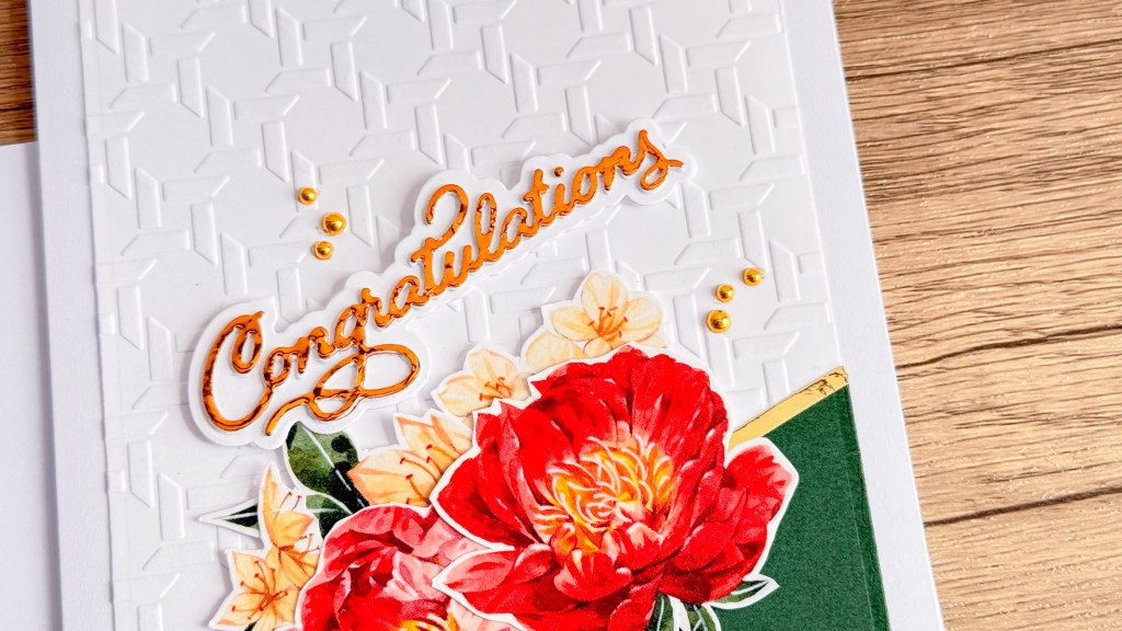 Peony die cuts with washi tape on embossed background.