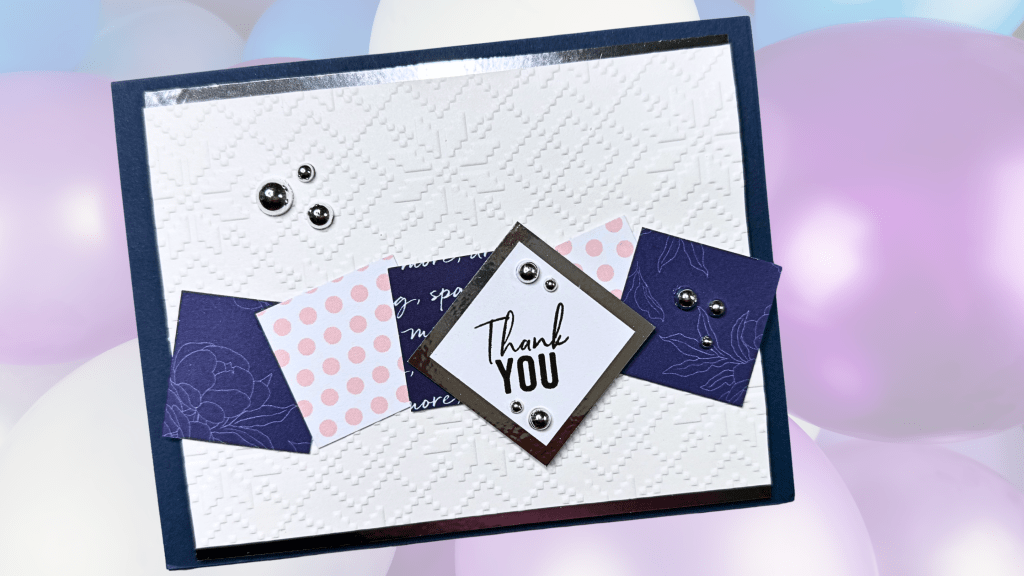 An elegant thank you card featuring a textured white background, various patterned paper in purple and pink, and metal embellishments.