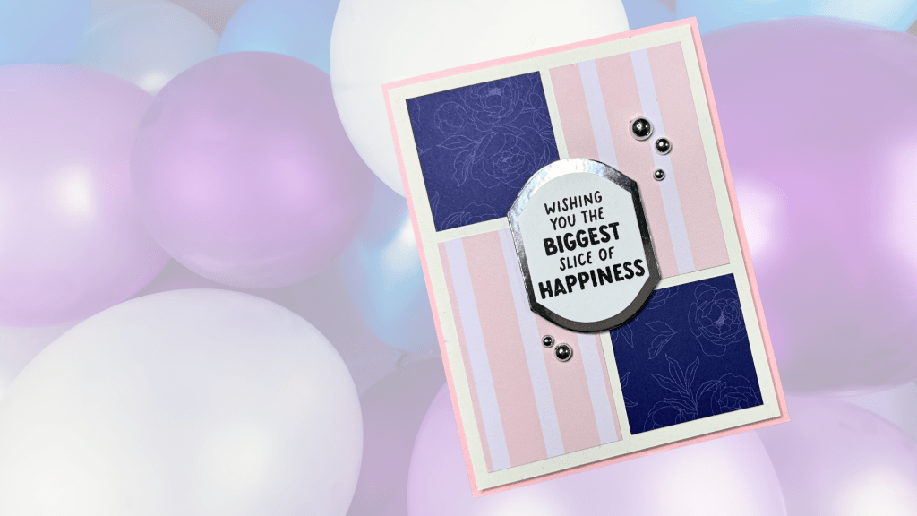 A handmade card featuring a sentiment that reads 'WISHING YOU THE BIGGEST SLICE OF HAPPINESS,' set against a background of pastel balloons in shades of pink, purple, and white.