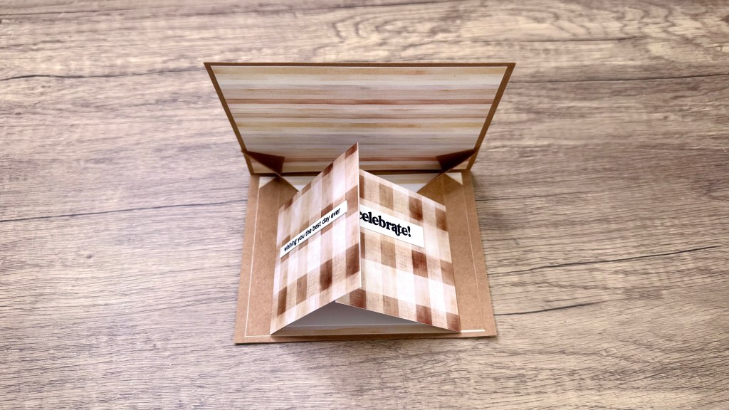 An open Double Pop-Up Card featuring a brown patterned design, with a message panel inside that reads 'Wishing you the best day ever!'