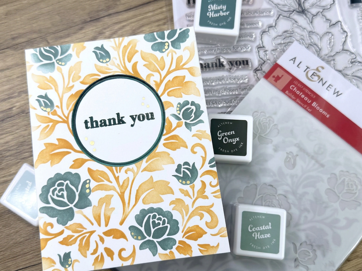 IMG_2404 Handmade thank you card with orange and teal floral design surrounded by stamping inks and clear stamp set