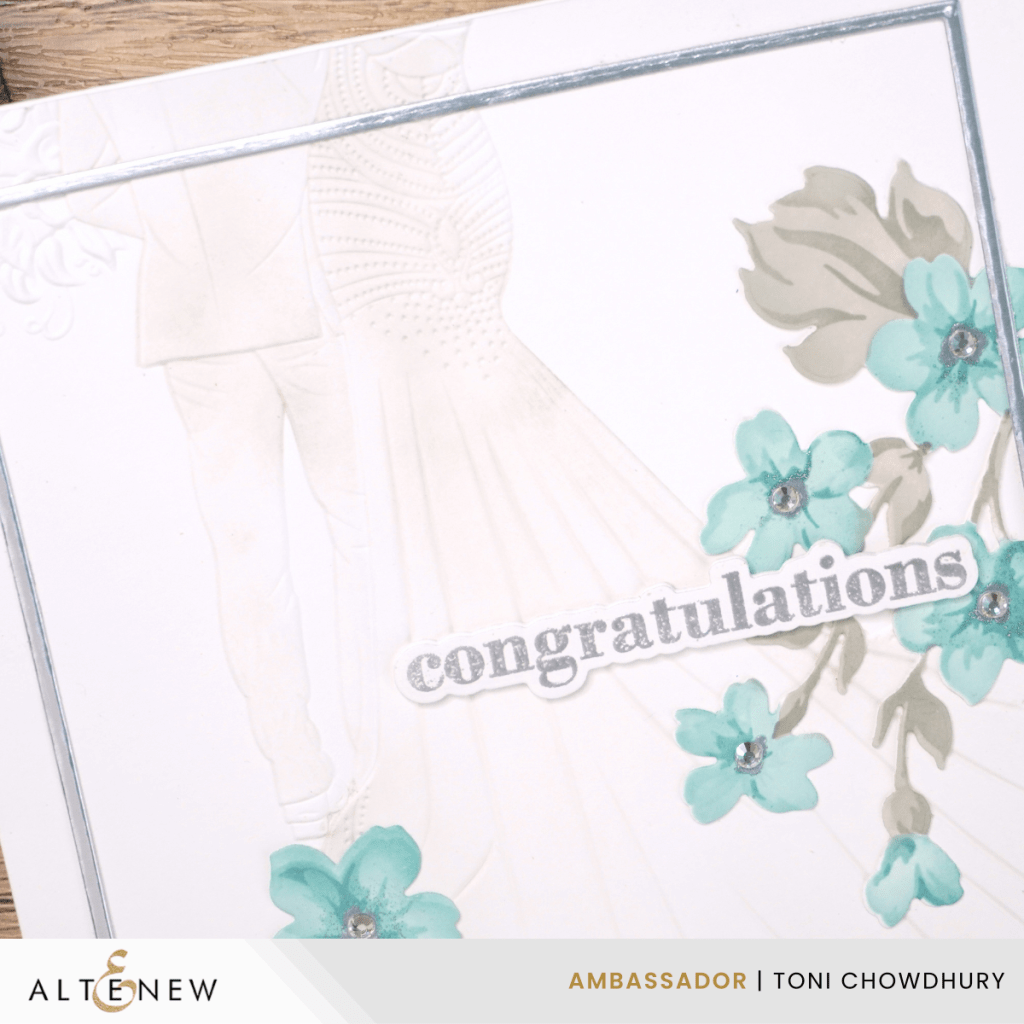 White congratulations card with embossed bride and groom, blue flowers with rhinestones