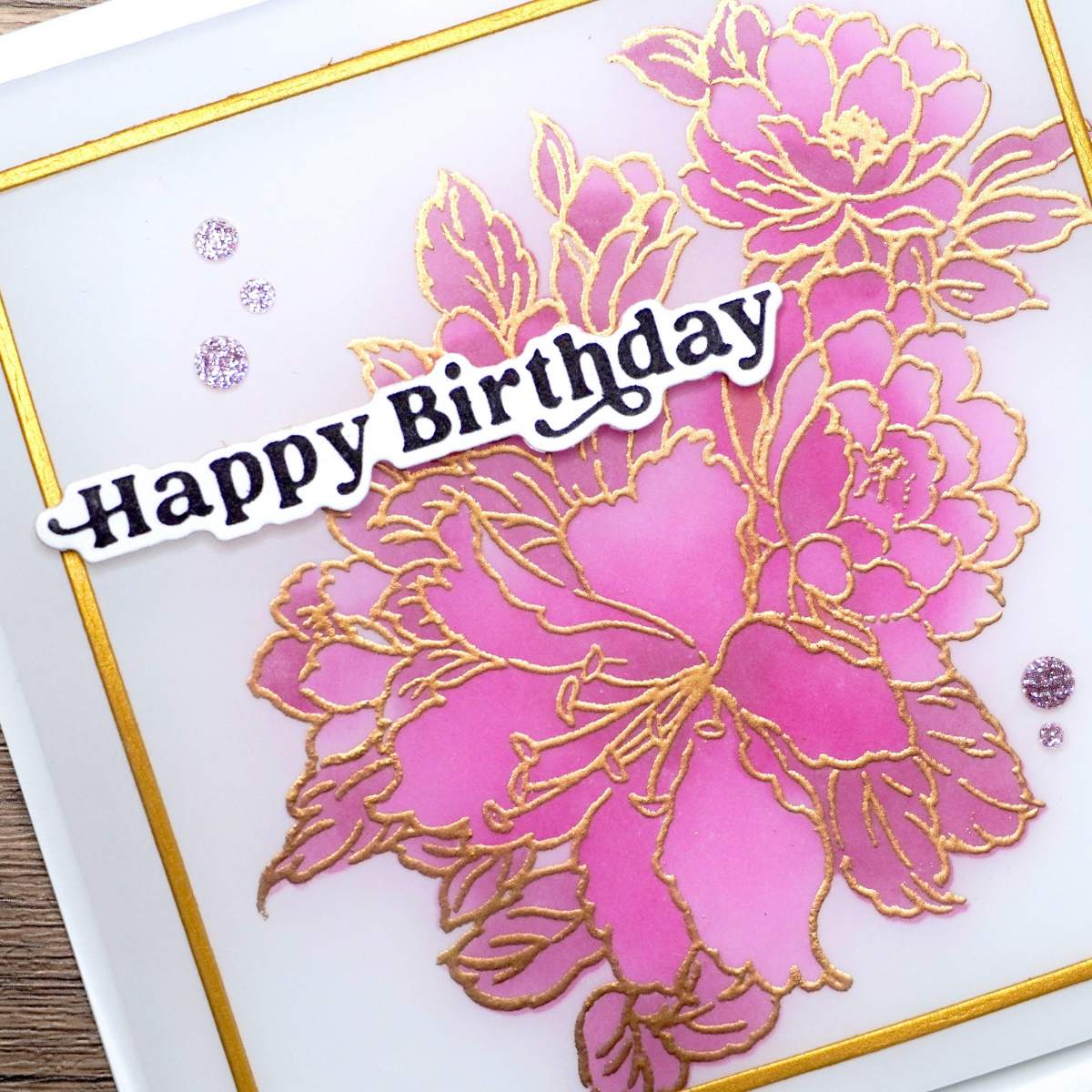 HandmadeCardsByToni-Vellum-Overlay-Card-2 Greeting card with pink and gold floral design and text 'Happy Birthday'