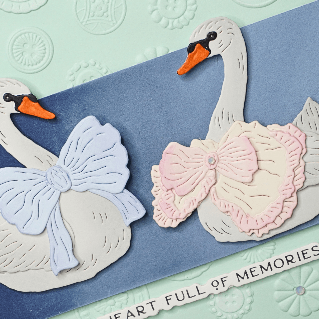 White pigment ink blended onto coloured cardstock to create a soft gradient effect.